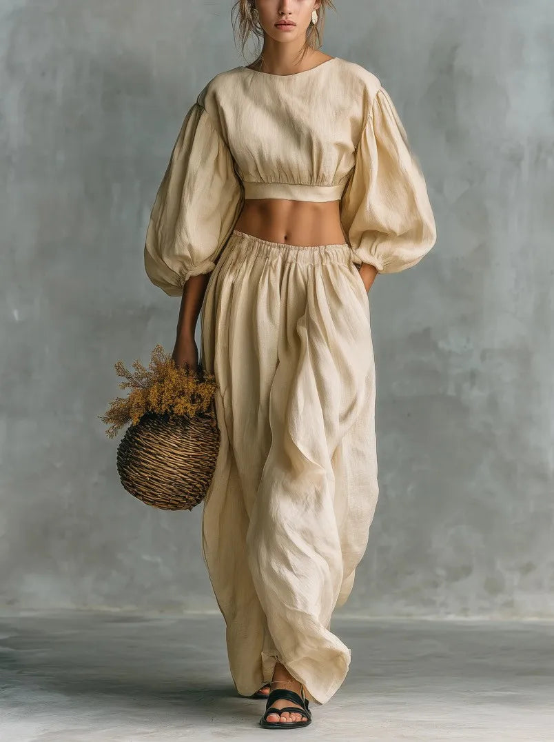 Stylish women's wide leg trouser set with balloon sleeves, ideal for a comfortable vacation or summer outfit.