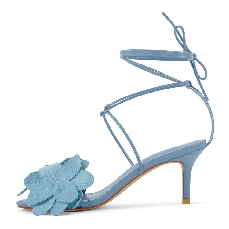 Women's Beatrice elegant strappy kitten heel sandals. Features an open toe, floral appliqué, and a secure ankle tie.