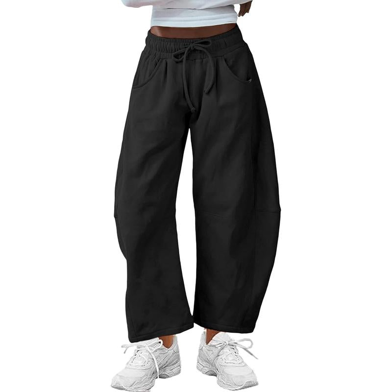 Women's black barrel-leg pants, relaxed fit & comfy drawstring waist for effortless modern style.