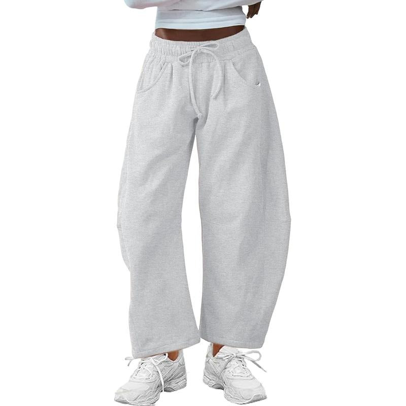 Gray barrel-leg women's pants, combining modern style with a comfortable, relaxed fit and adjustable drawstring.