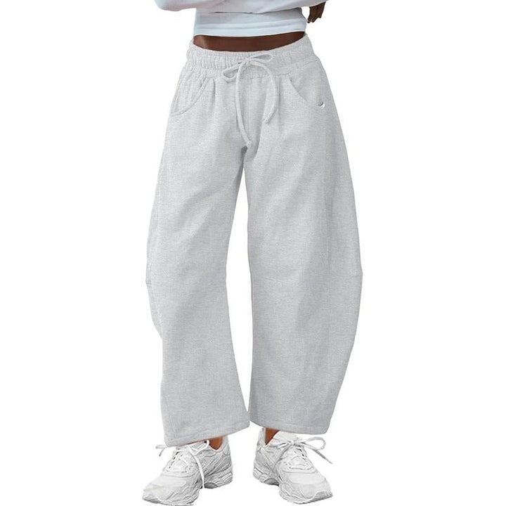 Gray barrel-leg women's pants, combining modern style with a comfortable, relaxed fit and adjustable drawstring.