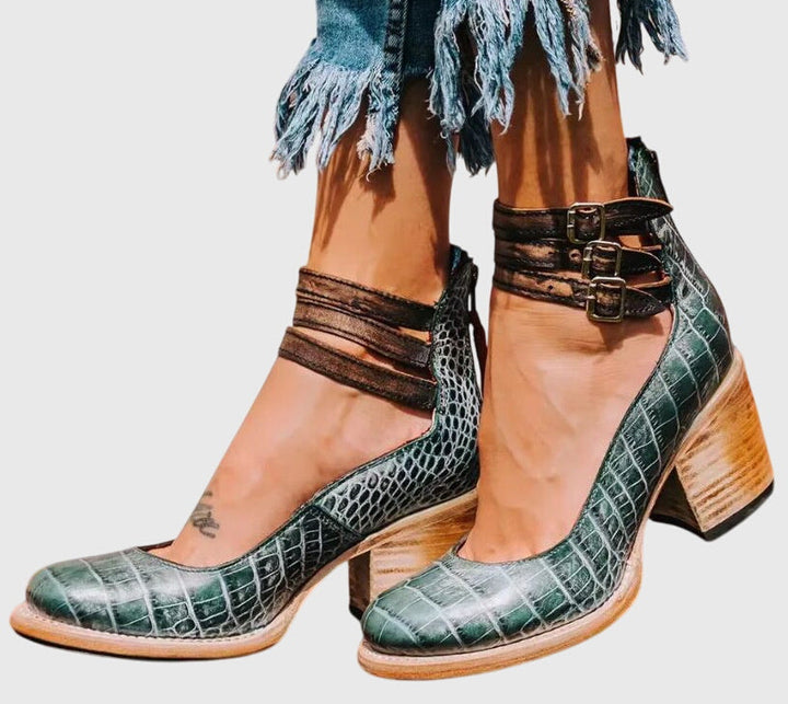 Elegant women's buckle strap ankle boots, perfect for any occasion, with a fashionable cutout and block heel.
