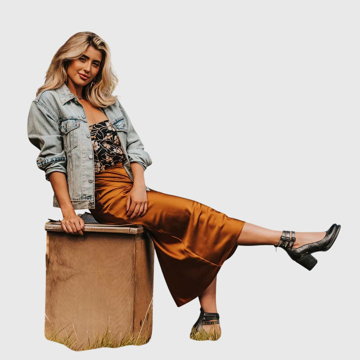 Stylish cutout women's ankle boots featuring chic buckle straps and a trendy block heel design.