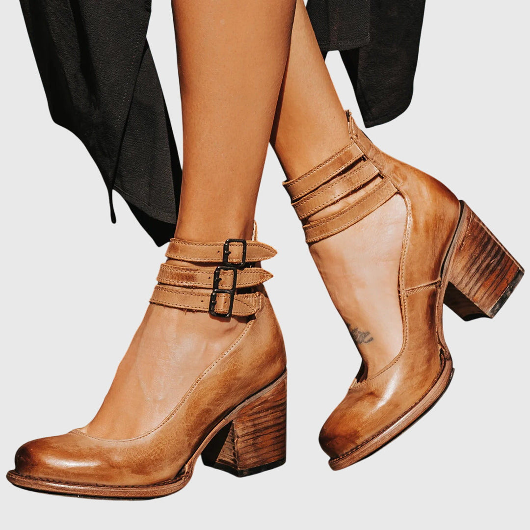 Chic women's ankle boots, ideal for event wear, featuring fashionable buckle straps and a block heel.