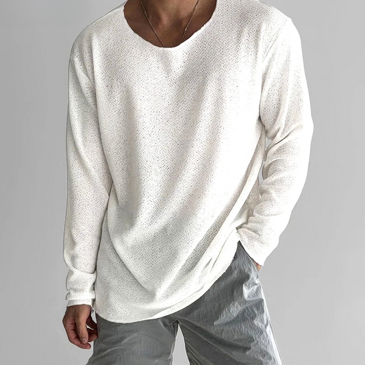 Women's black casual long-sleeve tee. Soft, breathable, & lightweight for everyday comfort & relaxed fit.