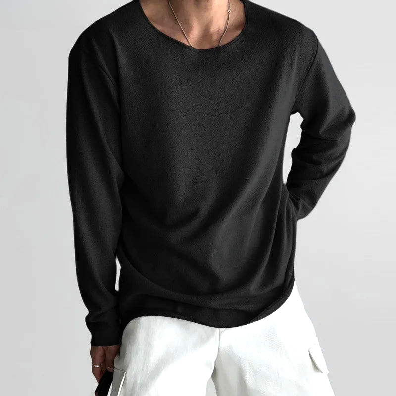 Soft white women's long-sleeve shirt with a relaxed fit. Perfect for casual everyday wear & minimalist style.