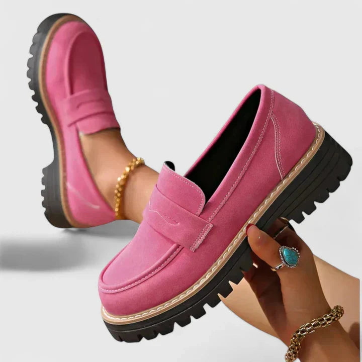 Stylish women's platform penny loafers with a chunky lug sole, versatile for everyday fashion or office wear.
