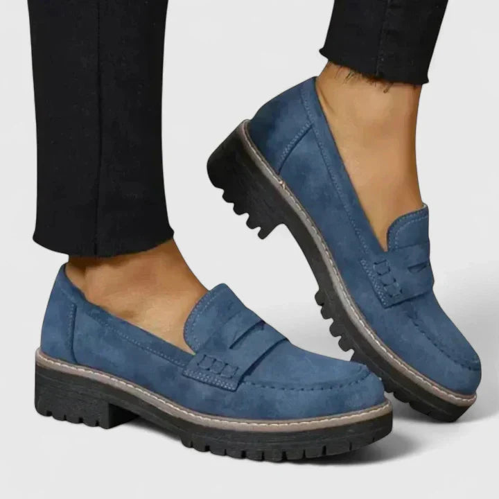 Modern women's slip-on chunky lug-sole penny loafers, offering both comfort and a fashionable, versatile look.