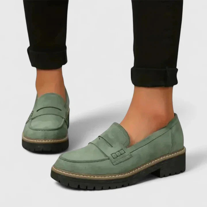 Elegant women's chunky platform penny loafers with a durable lug sole. Ideal for casual, dressy, and modern outfits.