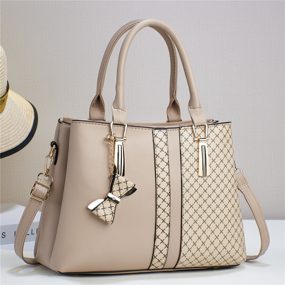 Adjustable strap detail on the black women's versatile convertible shoulder and crossbody bag.