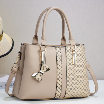 Adjustable strap detail on the black women's versatile convertible shoulder and crossbody bag.