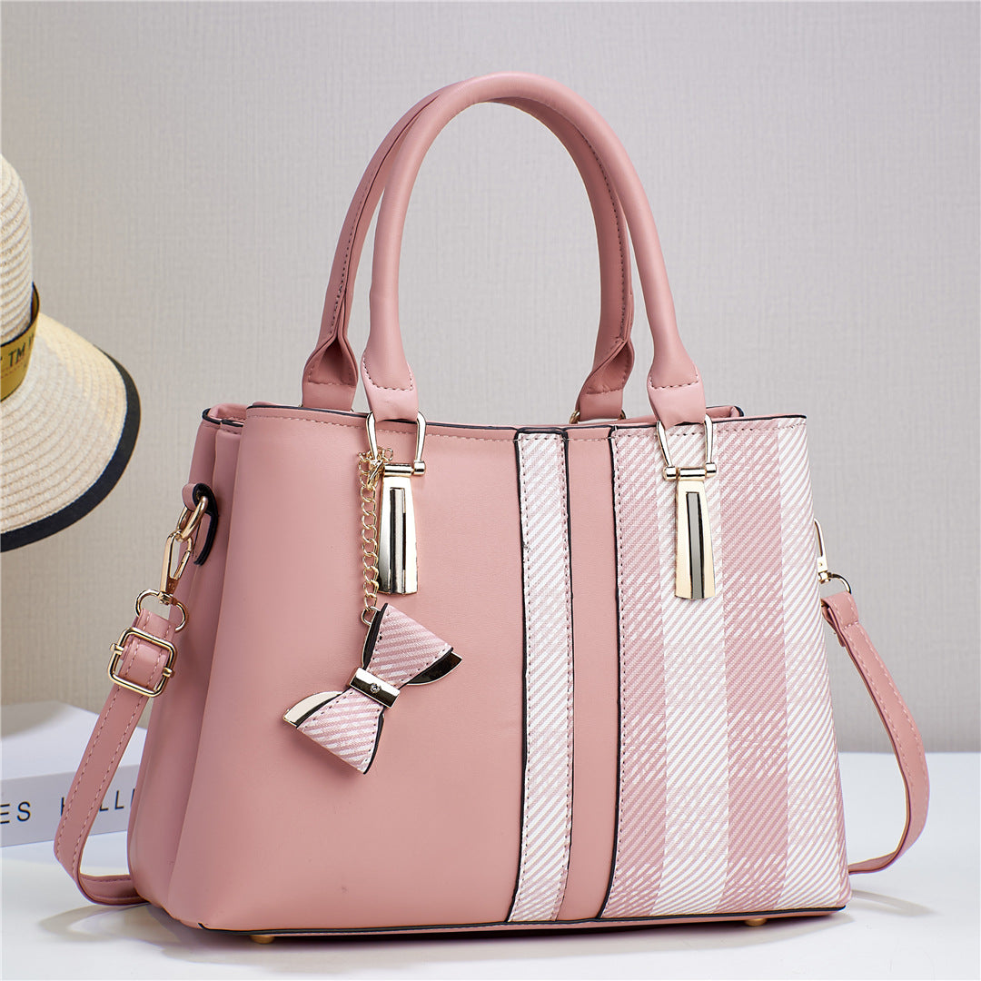 Elegant black women's convertible handbag, designed for versatile styling and daily essentials.