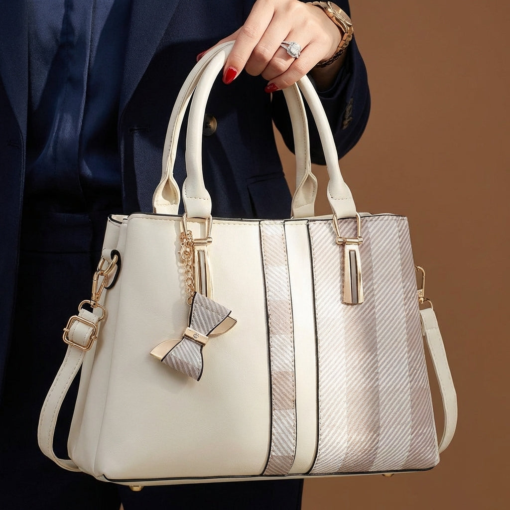 Stylish black women's convertible bag, transforms easily from crossbody to shoulder handbag.