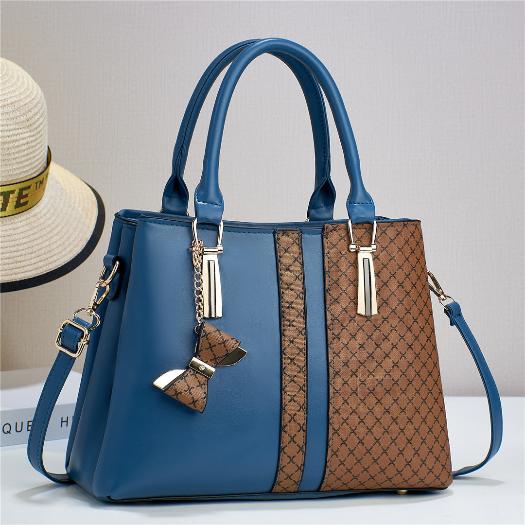 Black convertible women's shoulder bag displayed open, revealing organized interior pockets.