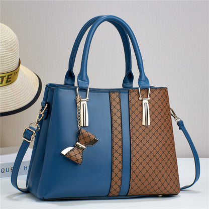 Black convertible women's shoulder bag displayed open, revealing organized interior pockets.