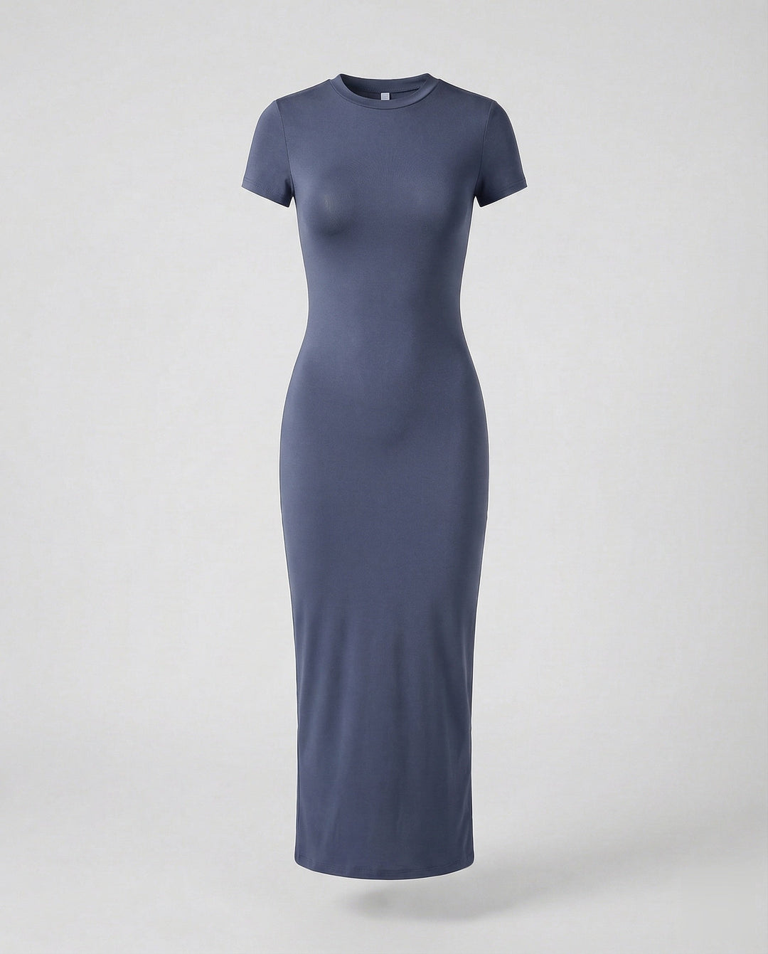 Woman posing in a comfortable & fashionable short sleeve bodycon maxi dress for modern, sleek style.