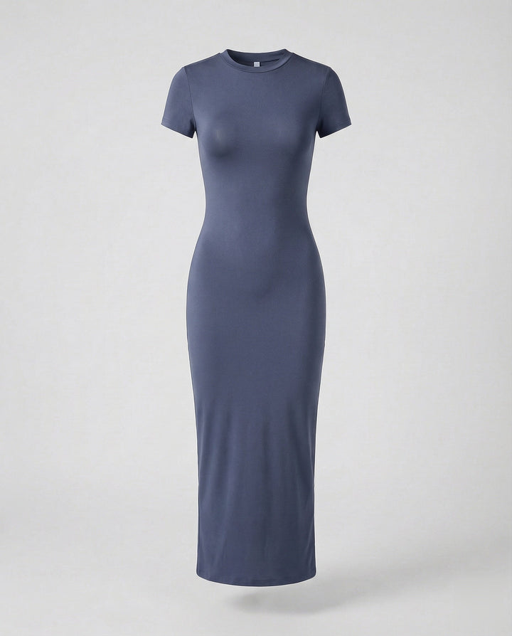 Woman posing in a comfortable & fashionable short sleeve bodycon maxi dress for modern, sleek style.
