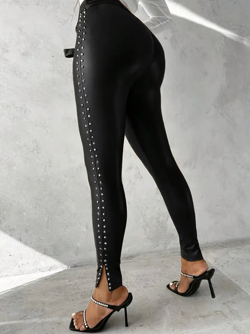 High-waisted black faux leather studded pants for women, skinny fit, perfect for edgy fashion statements.