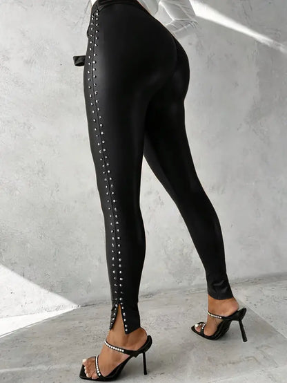High-waisted black faux leather studded pants for women, skinny fit, perfect for edgy fashion statements.