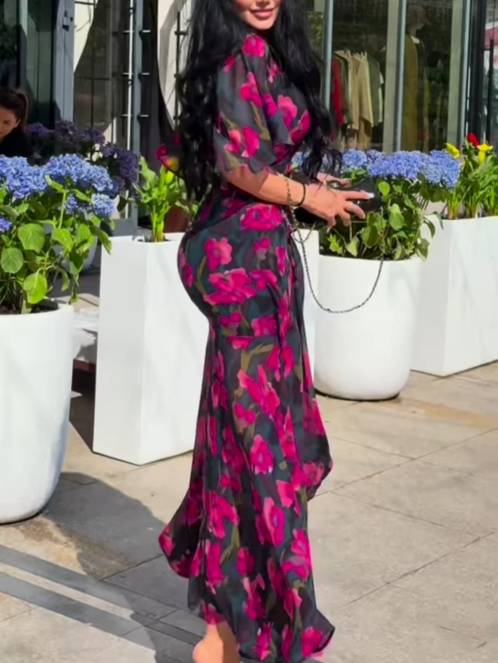 Black women's floral print maxi dress, V-neck, trumpet sleeves. Perfect flowy summer or party dress.