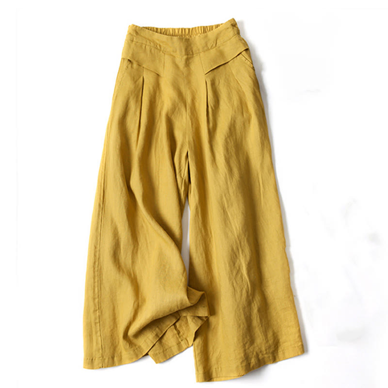 Women's black flowy wide-leg trousers, high-waisted for a relaxed, comfortable everyday style.