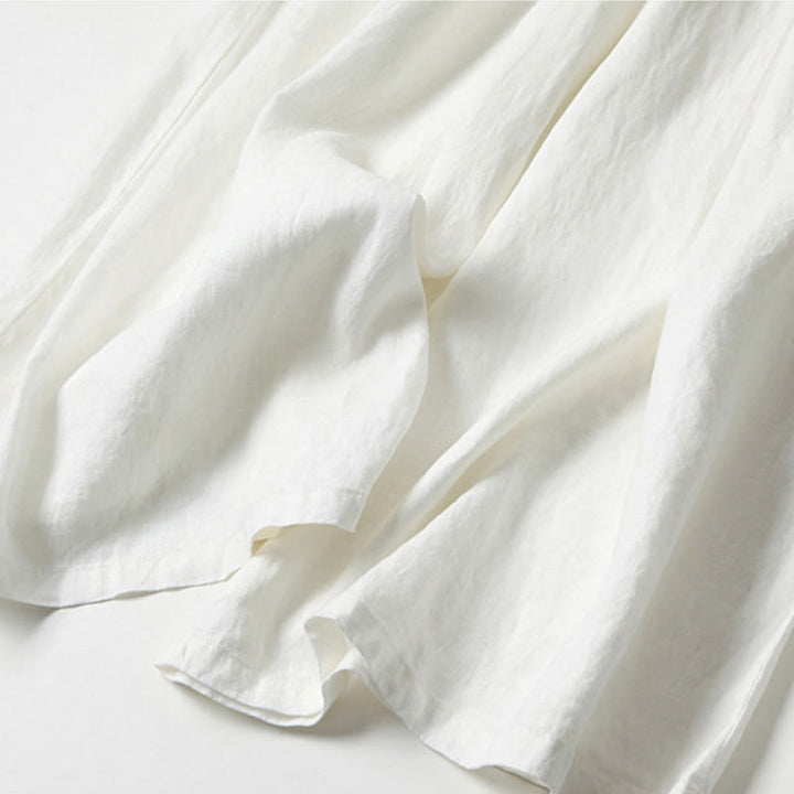Elegant women's flowy wide-leg trousers, high-waisted, providing a relaxed fit for polished everyday looks.