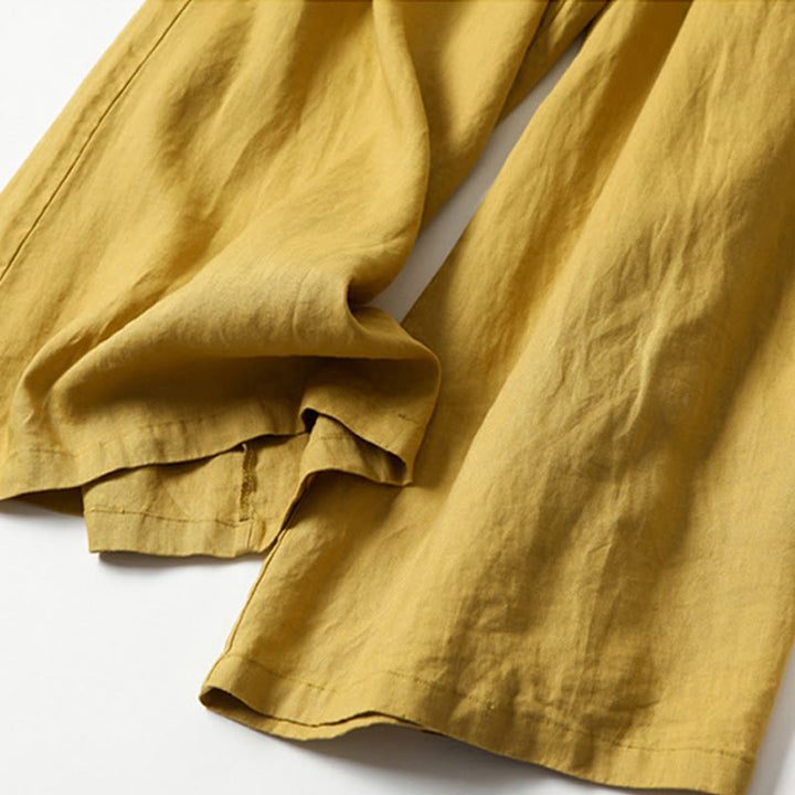 White women's high-waist flowy wide-leg pants, perfect for relaxed summer fashion and everyday wear.