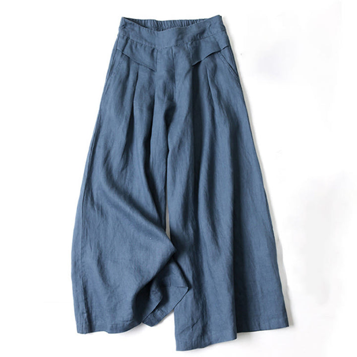 Grey women's flowy wide-leg trousers, high-waisted, offering a relaxed fit for versatile everyday outfits.