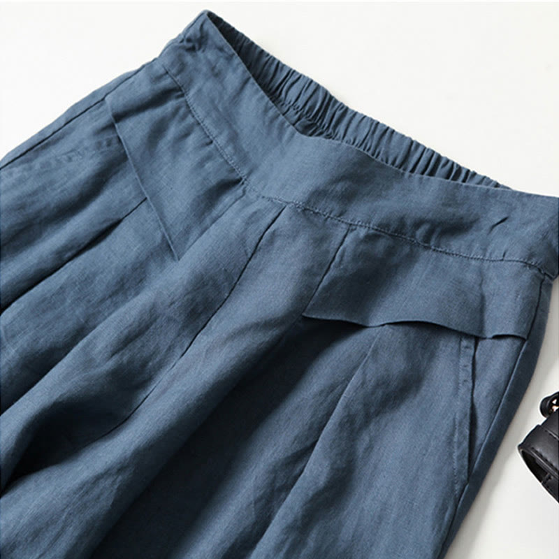Lightweight flowy wide-leg trousers for women, high-waisted and relaxed, great for warm weather.