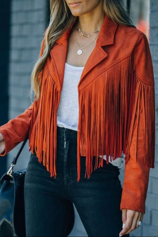 Women's black fringed moto jacket, offering an edgy, chic style. A perfect statement outerwear piece.