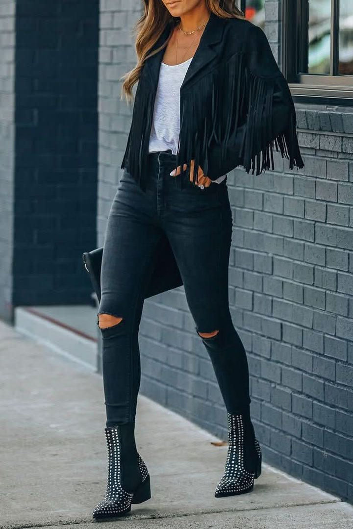Chic women's fringed moto jacket for an edgy look. Versatile outerwear, great for casual wear or a statement piece.