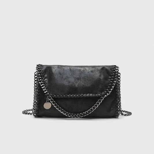 Women's black gothic shoulder bag with chain strap, vintage finish, a stylish fashion accessory for dark aesthetics.
