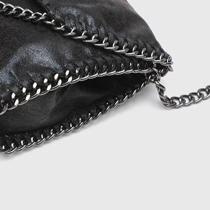Women's gothic style shoulder bag, a fashionable black bag with a distinctive chain strap and vintage feel.