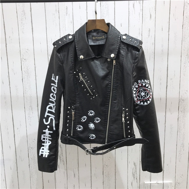 Edgy black women's jacket featuring modern rivet embellishments for a bold and fashionable outerwear look.