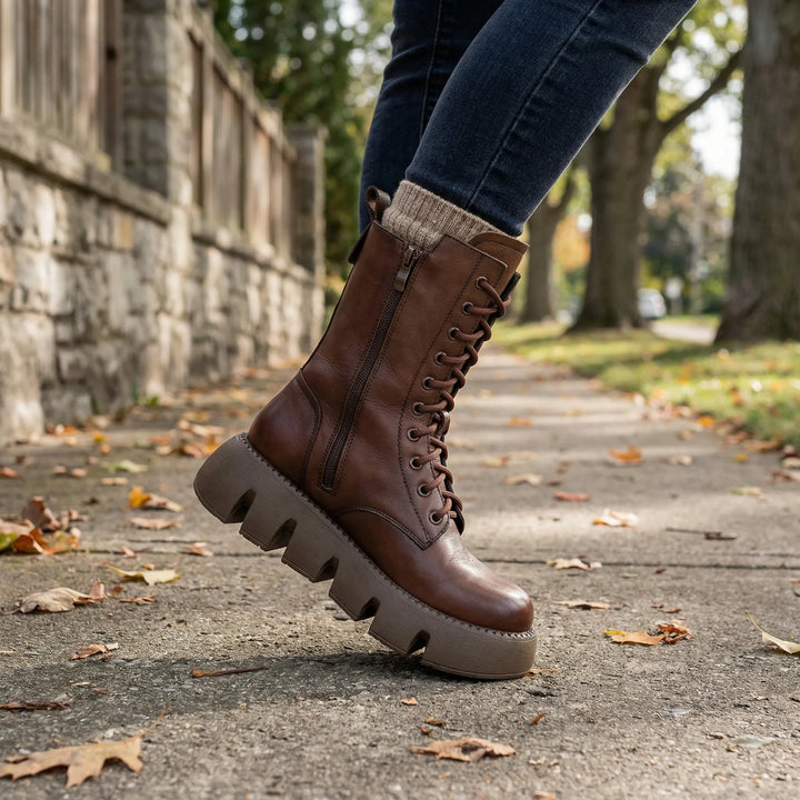 Women's black lace-up platform combat boots with arch support, perfect for comfortable everyday wear.