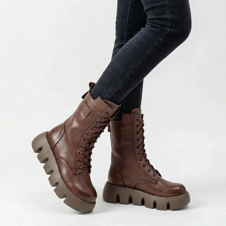 Stylish women's platform combat boots, lace-up design with arch support for fall and winter fashion.