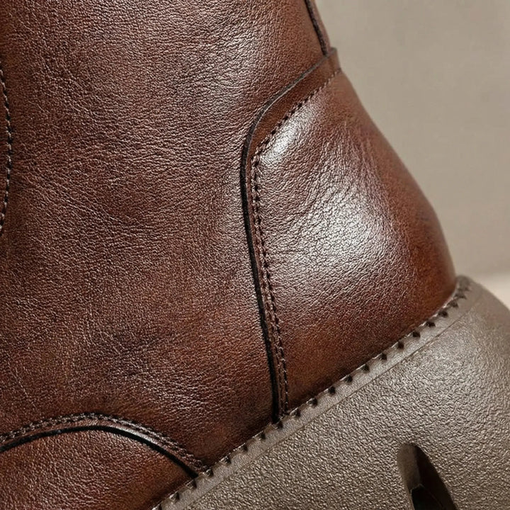 Durable women's combat boots, lace-up platform style with essential arch support for walking comfort.