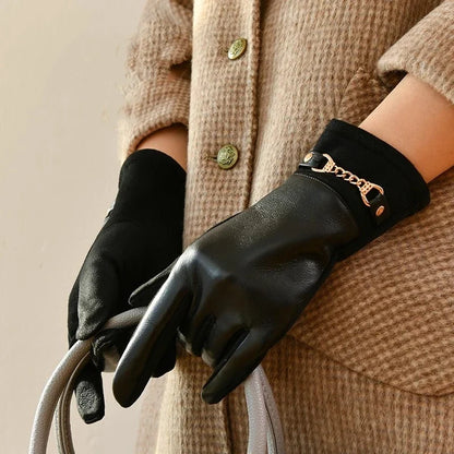 Women's black leather gloves with soft cashmere lining for warmth and elegance. Perfect for winter fashion.