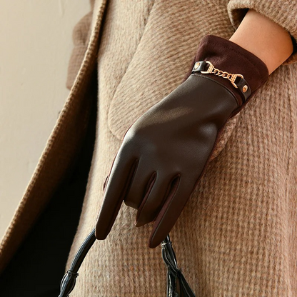 Stylish women's black leather gloves with a warm cashmere lining, perfect for cold weather and elegant ensembles.