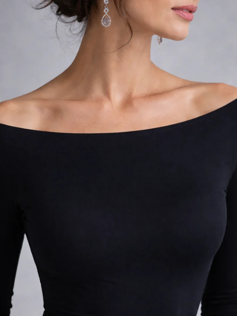 Elegant women's black off-shoulder long sleeve maxi dress with a sophisticated silhouette.