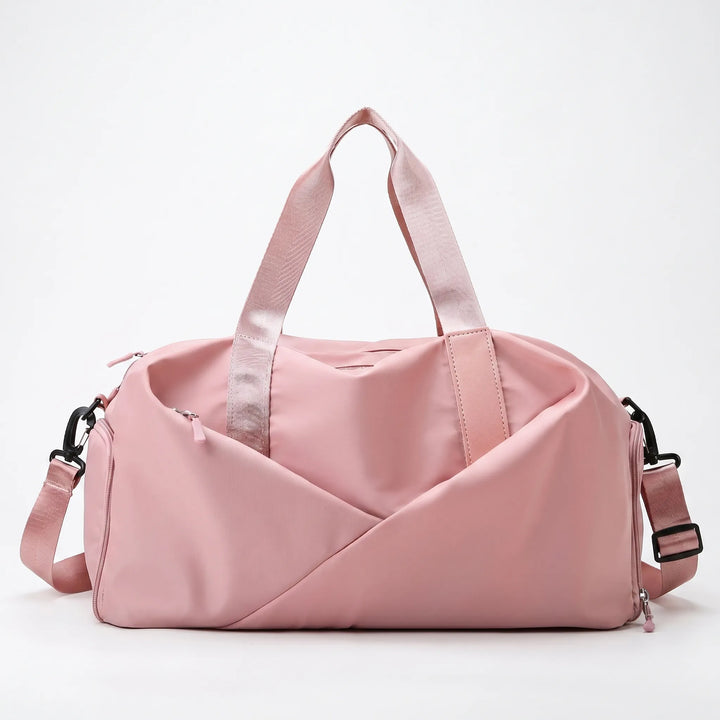 Versatile women's travel duffel bag, compact and organized for gym, weekend trips, and active lifestyles.
