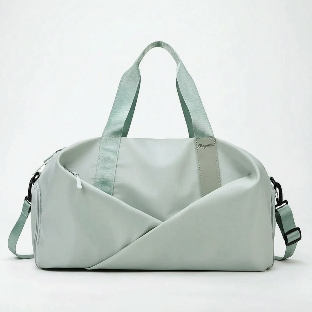 Modern women's sports duffel bag, spacious and organized, great for workout gear & activewear.