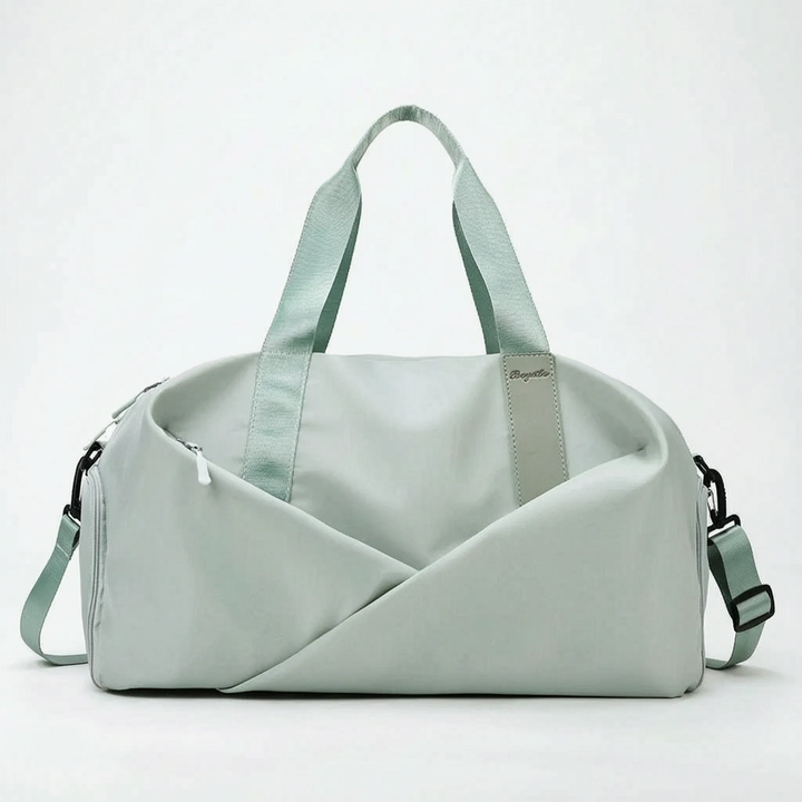 Modern women's sports duffel bag, spacious and organized, great for workout gear & activewear.