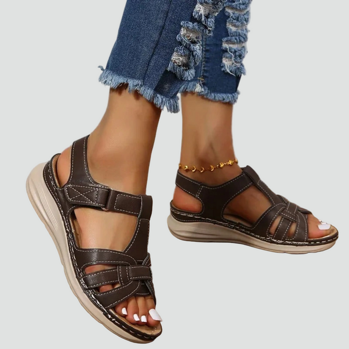 Women's open-toe orthopedic summer sandals. Adjustable straps ensure a comfortable, supportive fit for warm weather.