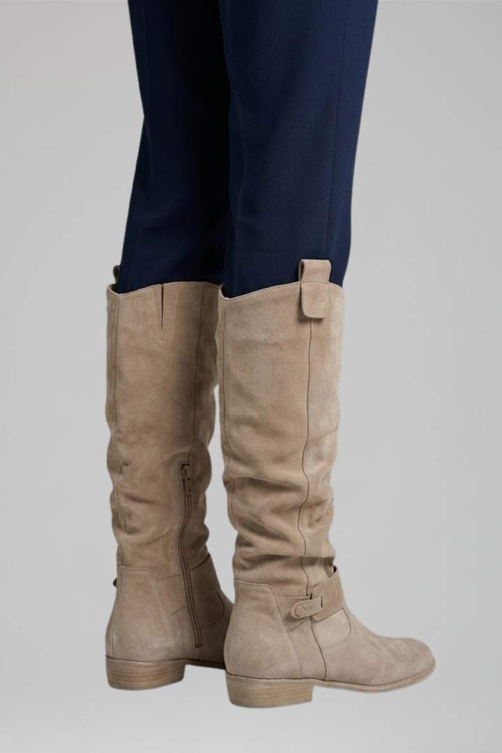 Classic black ladies knee-high orthopedic boots with side zipper for easy wear. Ideal for winter fashion.