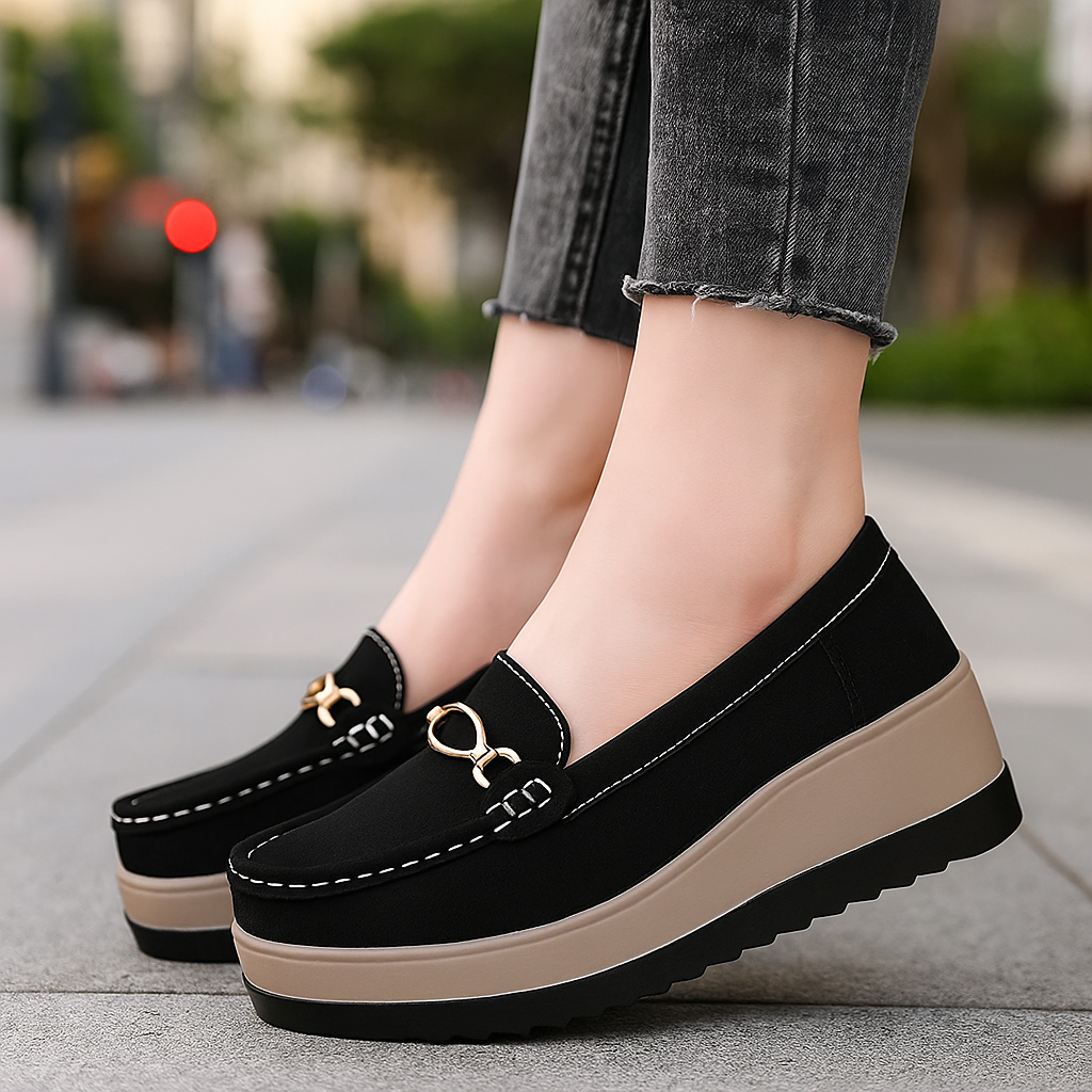 Women's black orthopedic platform loafers, offering all-day comfort and stylish design.
