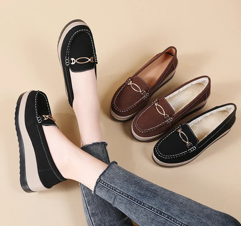 Stylish women's brown platform loafers, a comfortable slip-on choice for modern wardrobes.