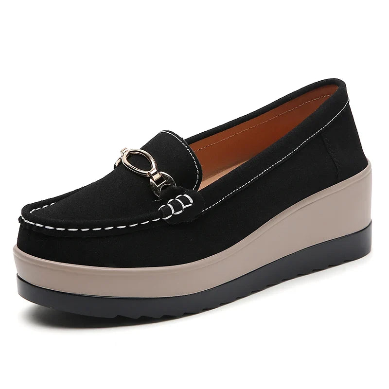 Chic black platform slip-on loafers for women, providing orthopedic comfort and easy wear.