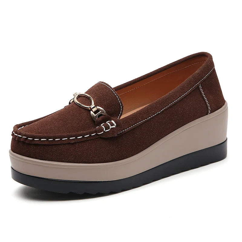 Women's orthopedic platform loafers in brown, offering a blend of fashion-forward design & support.