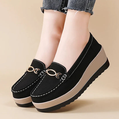 Fashionable black women's platform loafers, providing excellent support and a chic look.
